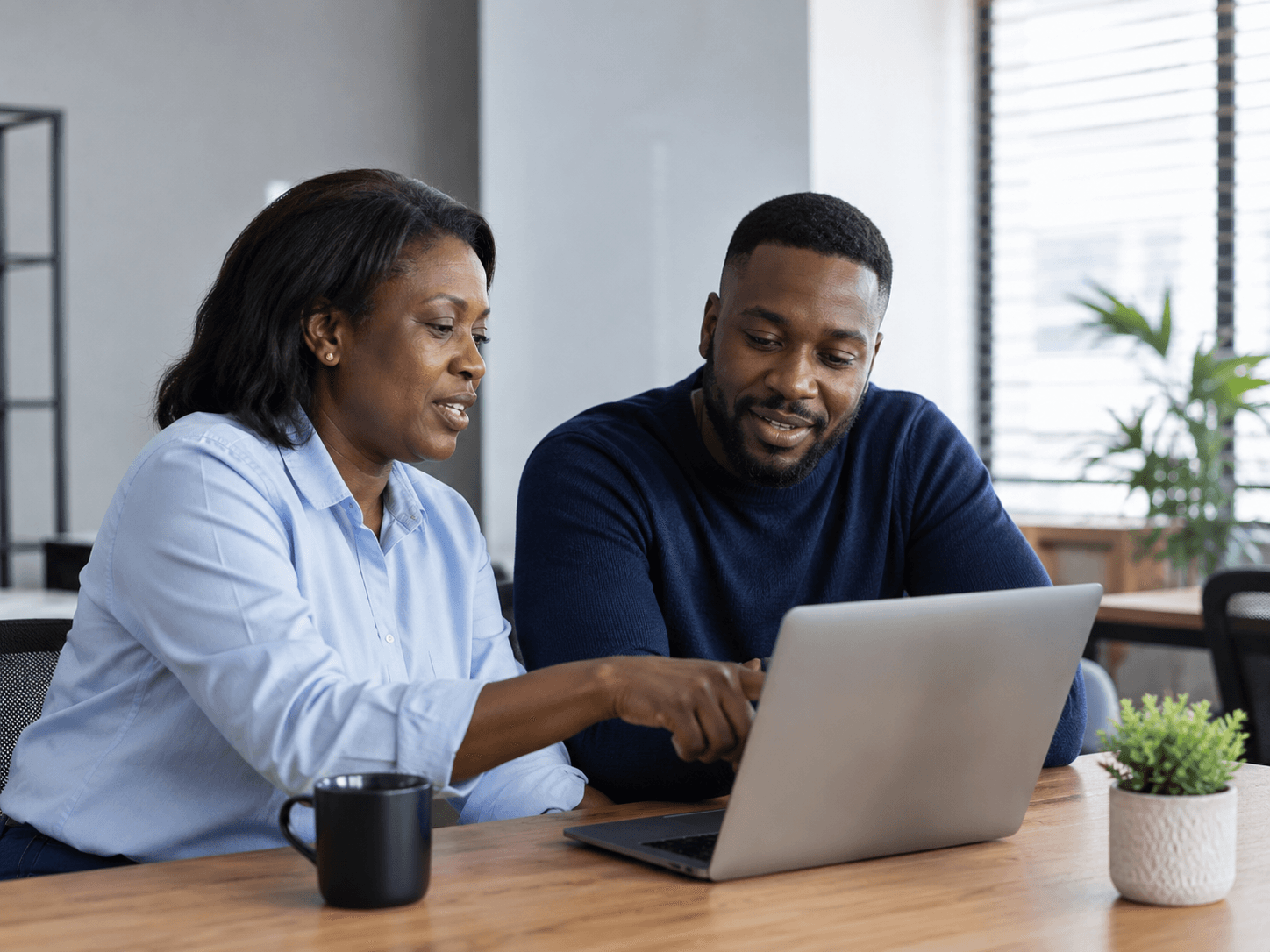 A business owner and her accountant reviewing the books together